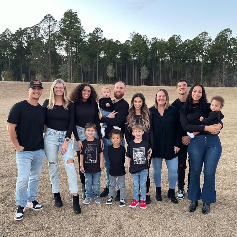 Extended family field audit — all wearing black, verdict unanimous